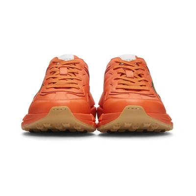 Shop Gucci Orange Logo Rhyton Sneakers In 7519 Orange