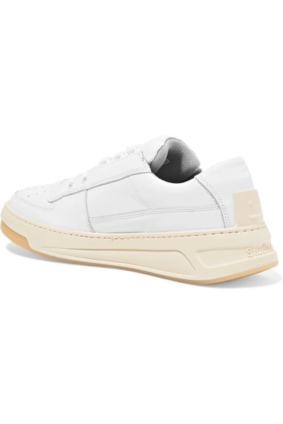 Shop Acne Studios Logo-embossed Leather Sneakers In White