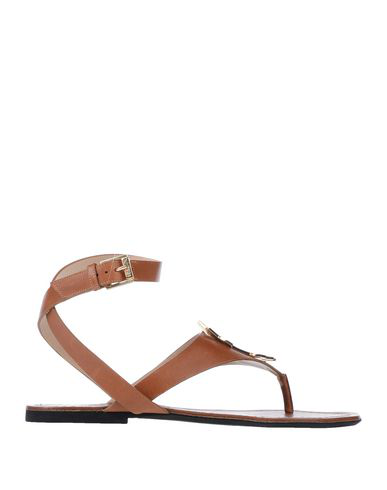 tan and black flip flops