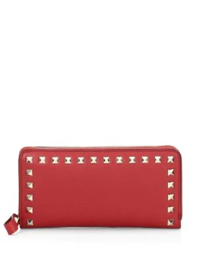 Shop Valentino Rockstud Leather Zip Around Continental Wallet In Red