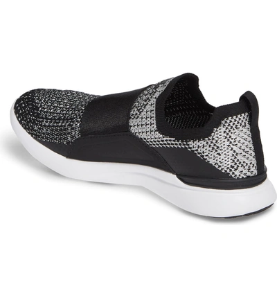 Shop Apl Athletic Propulsion Labs Techloom Bliss Knit Running Shoe In Black/ Metallic Silver/ White