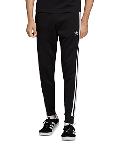 Shop Adidas Originals 3-stripes Jogger Pants In Black