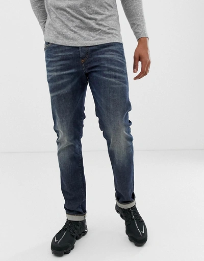 Shop Diesel Buster Regular Slim Fit Jeans In 084zu Mid Wash - Blue