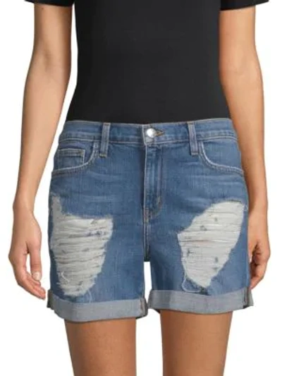 Shop L Agence Balboa Distressed Rolled Denim Shorts In Blue