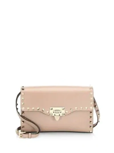 Shop Valentino Small Rockstud Leather Crossbody Bag In Poudre