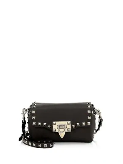 Shop Valentino Garavani Mini Rockstud Leather Crossbody Bag In Black