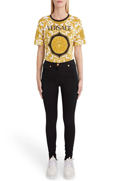 Shop Versace Hibiscus Print Allover Graphic Tee In Black Print