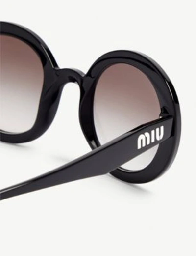 Shop Miu Miu Womens Black Round Frame Sunglasses