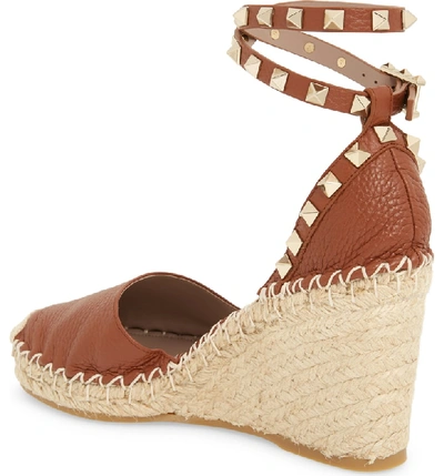 Shop Valentino Rockstud Espadrille Wedge Sandal In Bright Cognac