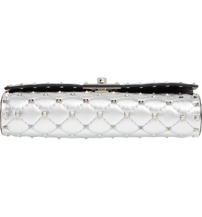 Shop Valentino Rockstud Metallic Leather Clutch - Metallic In Silver