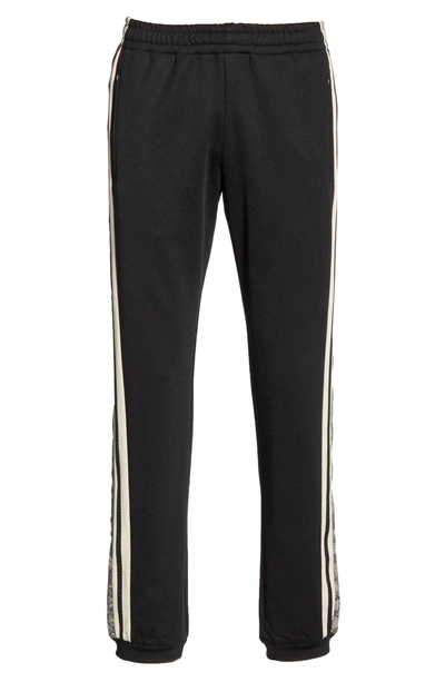 Shop Gucci Side Stripe Jogger Pants In Black