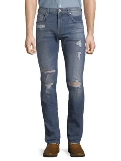 Shop 7 For All Mankind Paxtyn Distressed Jeans In Indigo