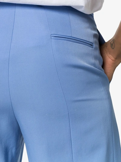 Shop Stella Mccartney High Waist Back Slit Wool Trousers In 4400 Blue