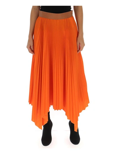 Shop Loewe Pleated Asymmetric Hem Skirt In Orange