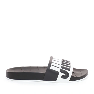 Shop Jimmy Choo Rey/m Black And White Logo Embossed Leather And Rubber Sliders In Black/white