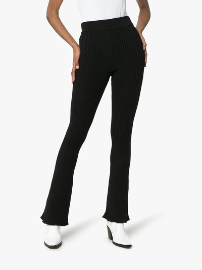 Shop Loewe High-waisted Knitted Flare Trousers In 101 Black