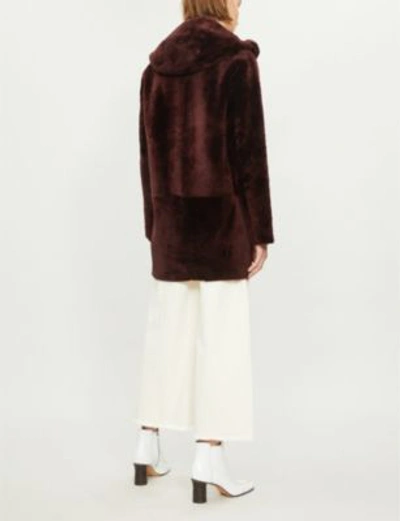 Shop Sandro Reversible Hooded Leather And Shearling Coat In Bordeaux