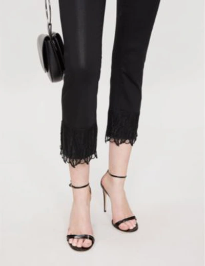 Shop J Brand Selena Bootcut Mid-rise Coated Jeans In Black Out