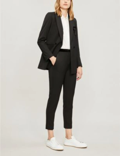 Shop Sandro Velvet-trimmed High-rise Skinny Woven Trousers In Noir