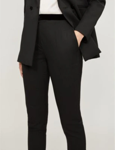 Shop Sandro Velvet-trimmed High-rise Skinny Woven Trousers In Noir