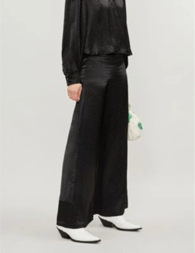 Shop Ganni Women's Black Polka Dot Print Cameron High-rise Wide Satin Trousers