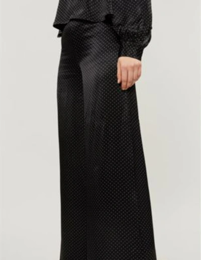 Shop Ganni Women's Black Polka Dot Print Cameron High-rise Wide Satin Trousers