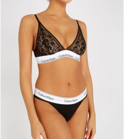 Shop Calvin Klein Modern Cotton Jersey And Lace Thong In 001 Black