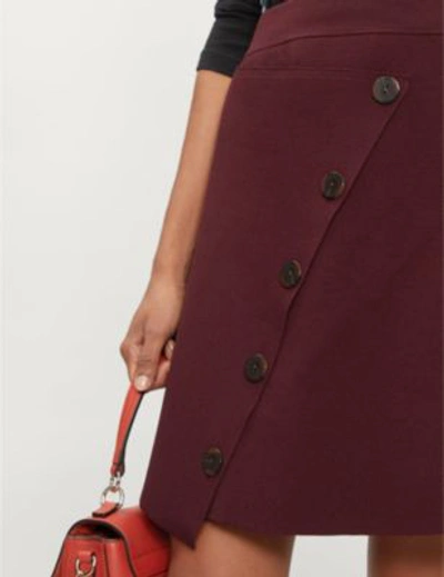 Shop Sandro Asymmetric Button-down Knitted Skirt In Burgundy