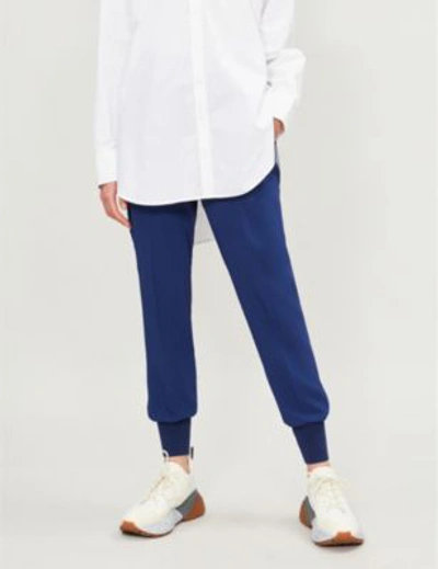 Shop Stella Mccartney Julia High-rise Tapered Crepe Trousers In Blue Note