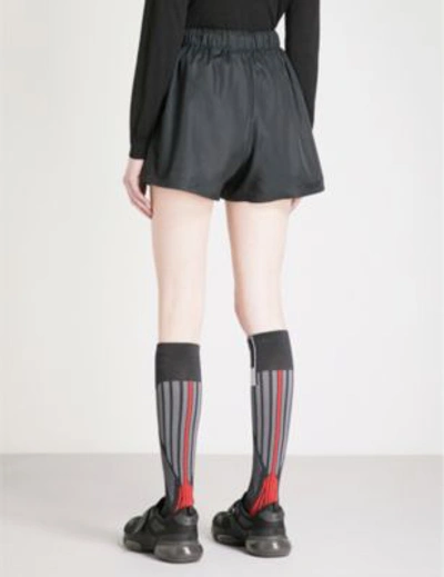 Shop Prada Logo-embroidered Nylon Shorts In Nero