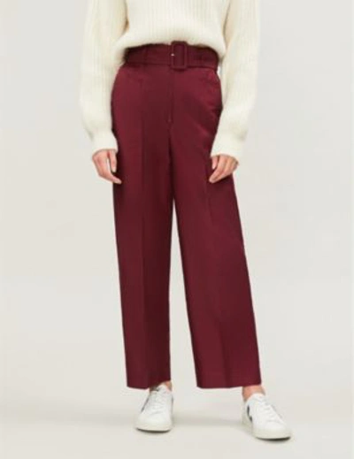 Shop Sandro Aloes Belted High-rise Wide-leg Cotton-blend Twill Trousers In Burgundy