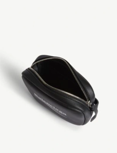 Shop Balenciaga Everyday Xs Logo Leather Camera Bag In Black