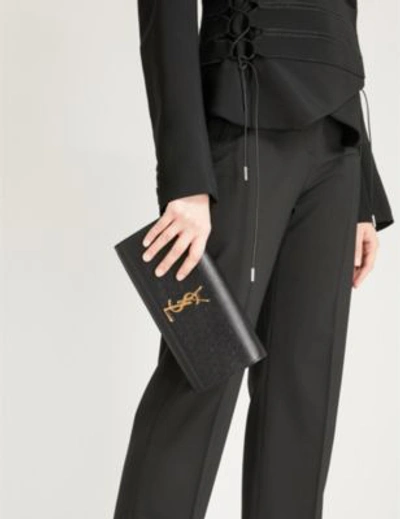 Shop Saint Laurent Black And Gold Cassandre Leather Clutch Bag In Black/gold