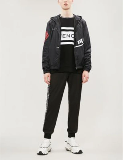 Shop Givenchy Logo-print Shell Hooded Jacket In Black