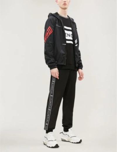 Shop Givenchy Logo-print Shell Hooded Jacket In Black