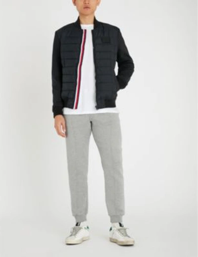 Shop Tommy Hilfiger Striped-trim Shell And Cotton-jersey Bomber Jacket In Jet Black