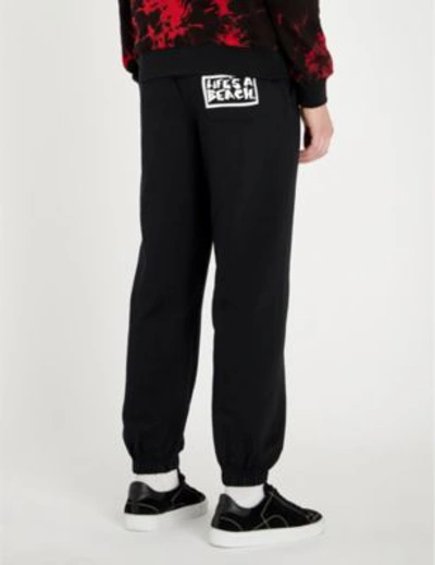 Shop Lifes A Beach Logo-print Cotton-jersey Jogging Bottoms In Black