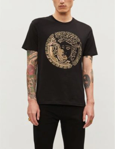 Shop Versace Stud-embellished Logo-print Cotton-jersey T-shirt In Nero