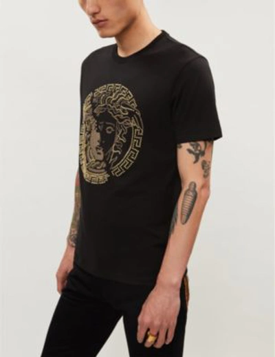 Shop Versace Stud-embellished Logo-print Cotton-jersey T-shirt In Nero