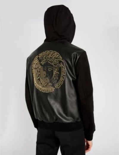 Shop Versace Logo-print Leather And Cotton-jersey Hooded Jacket In Nero