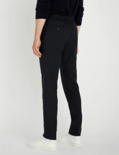 Shop Sandro Regular-fit Tapered Woven Trousers In Marine