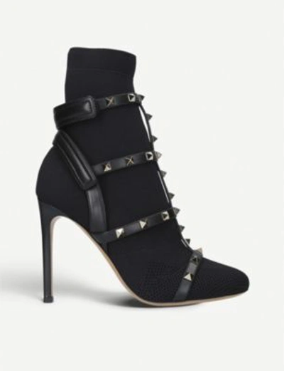 Shop Valentino Rockstud Bodytech Knitted And Leather Boots In Black