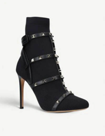 Shop Valentino Rockstud Bodytech Knitted And Leather Boots In Black