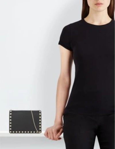 Shop Valentino Rockstud Small Leather Cross-body Bag In Black