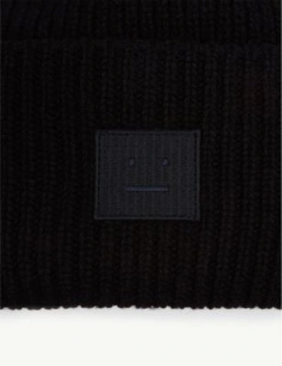 Shop Acne Studios Pansy Face Knitted Wool Beanie In Black