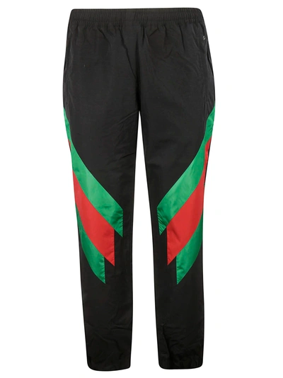 Shop Gucci Stripe Slim Fit Track Pants In Black Green Red