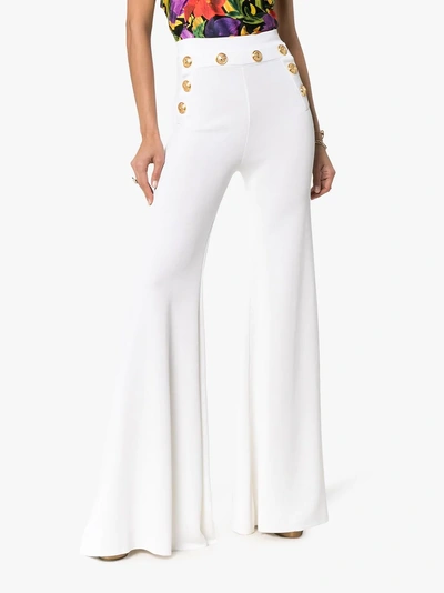 Shop Balmain High Waist Button Detail Flared Trousers In 0fb White
