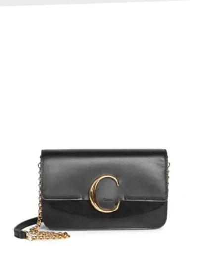 Shop Chloé C Leather Clutch In Black