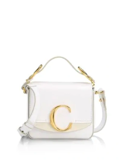 Shop Chloé Mini  C Leather Crossbody Bag In White