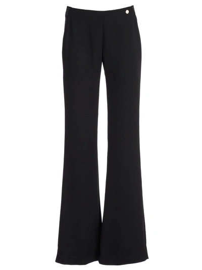 Shop Versace Flared Trousers In Nero